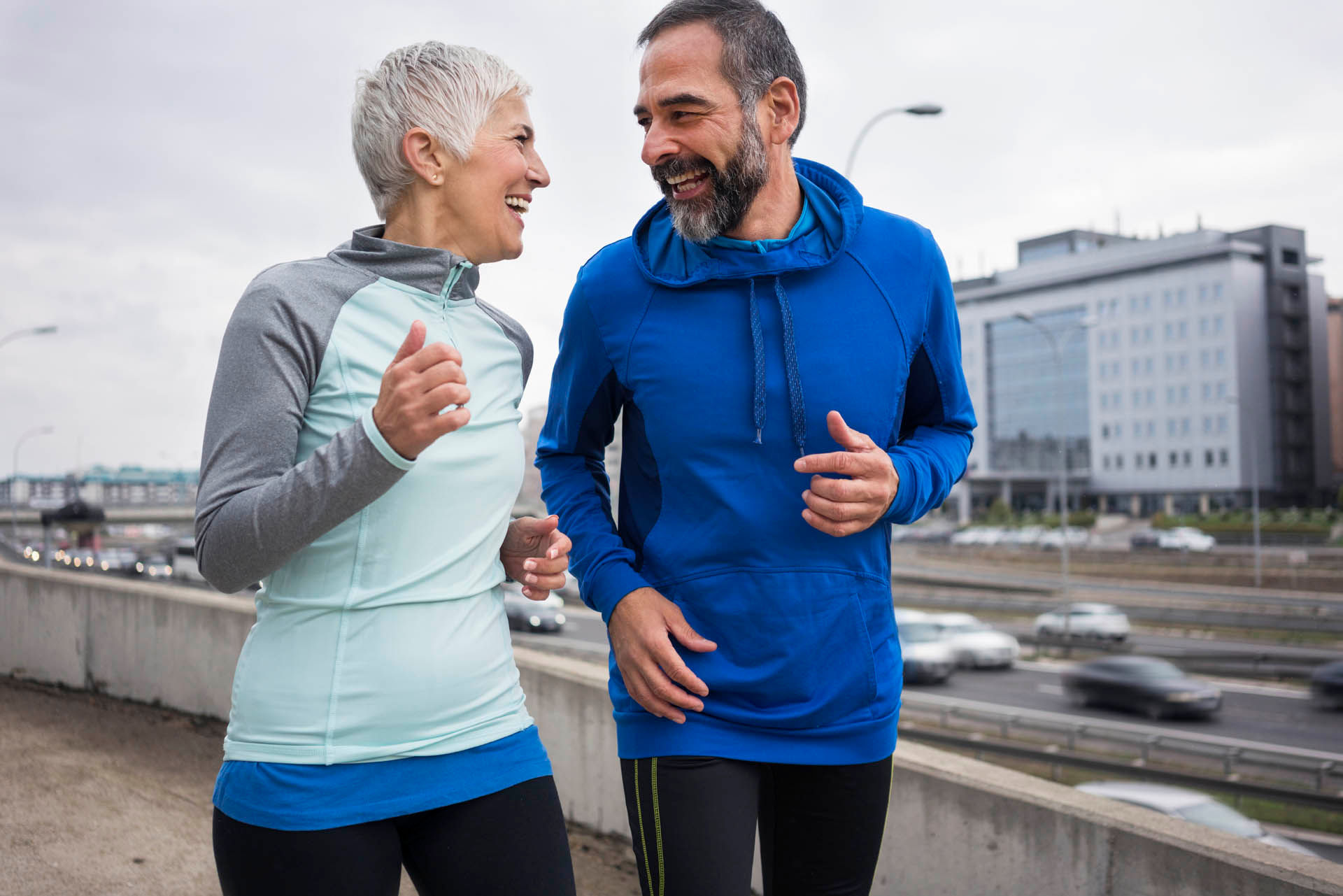 Man and Woman jogging in outdoor urban setting