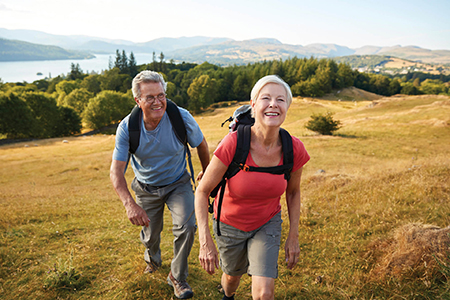 A mature couple hiking.