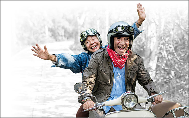 Thumbnail of a couple riding a scooter