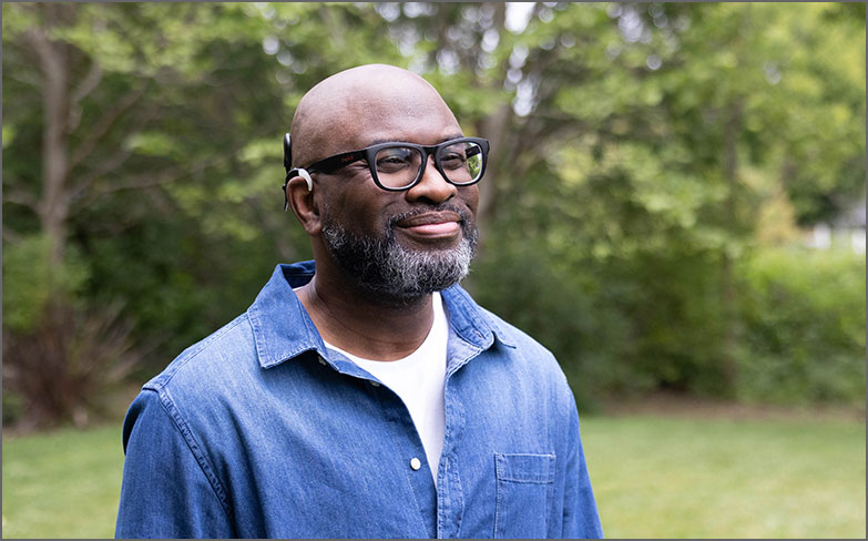Recipient with Advanced Bionics cochlear implant sound processor at the park.